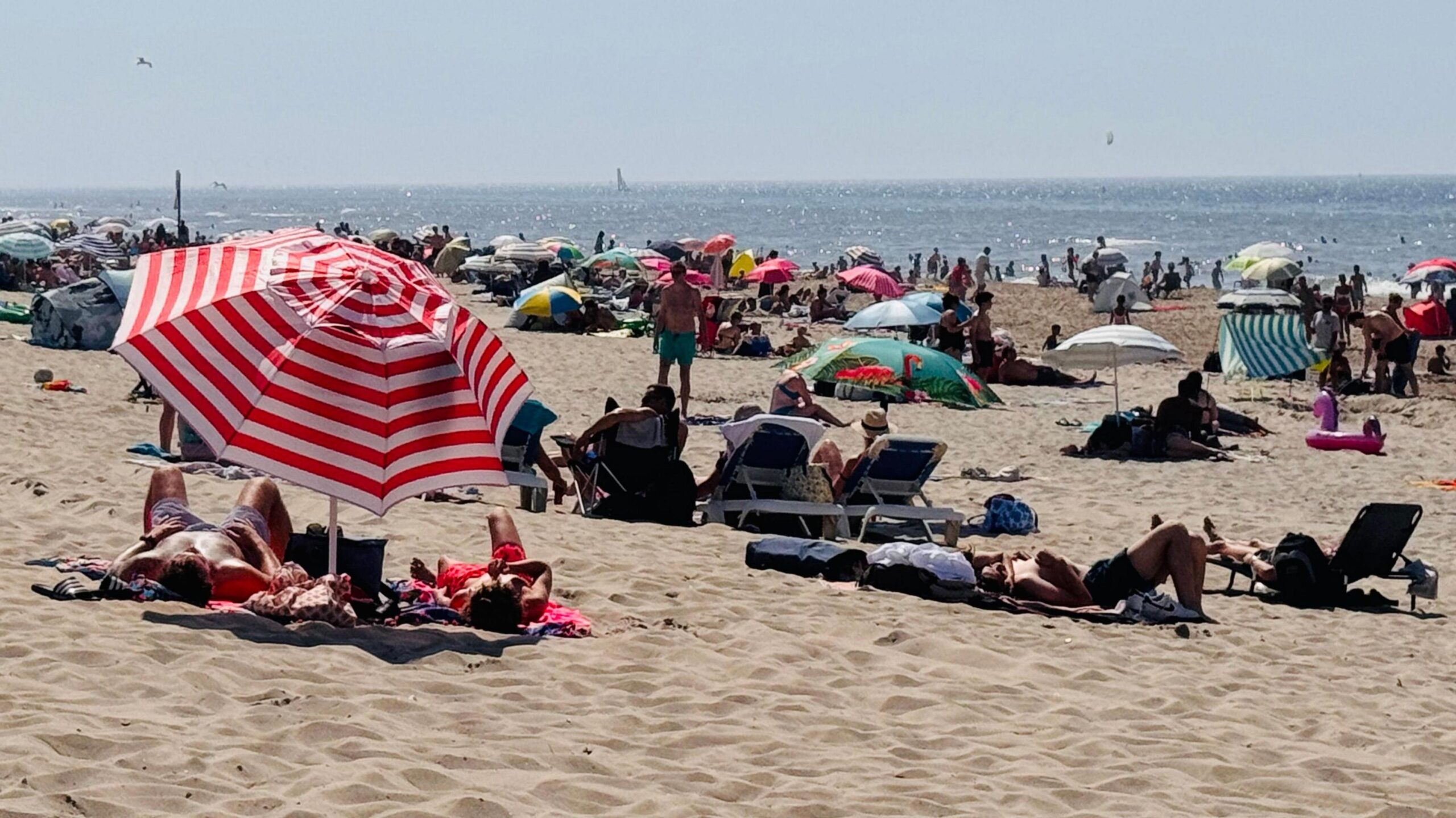Holidaymakers on a beach in The Hague, Netherlands