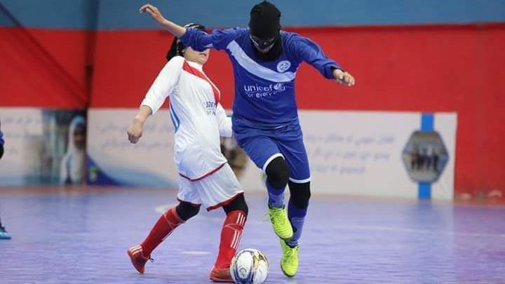 Manozh Noori wearing a face mask to hide her identity while playing a match in Afghanistan