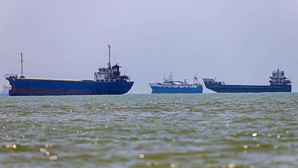 Three vessels anchored in Bandar Abbas along the Strait of Hormuz