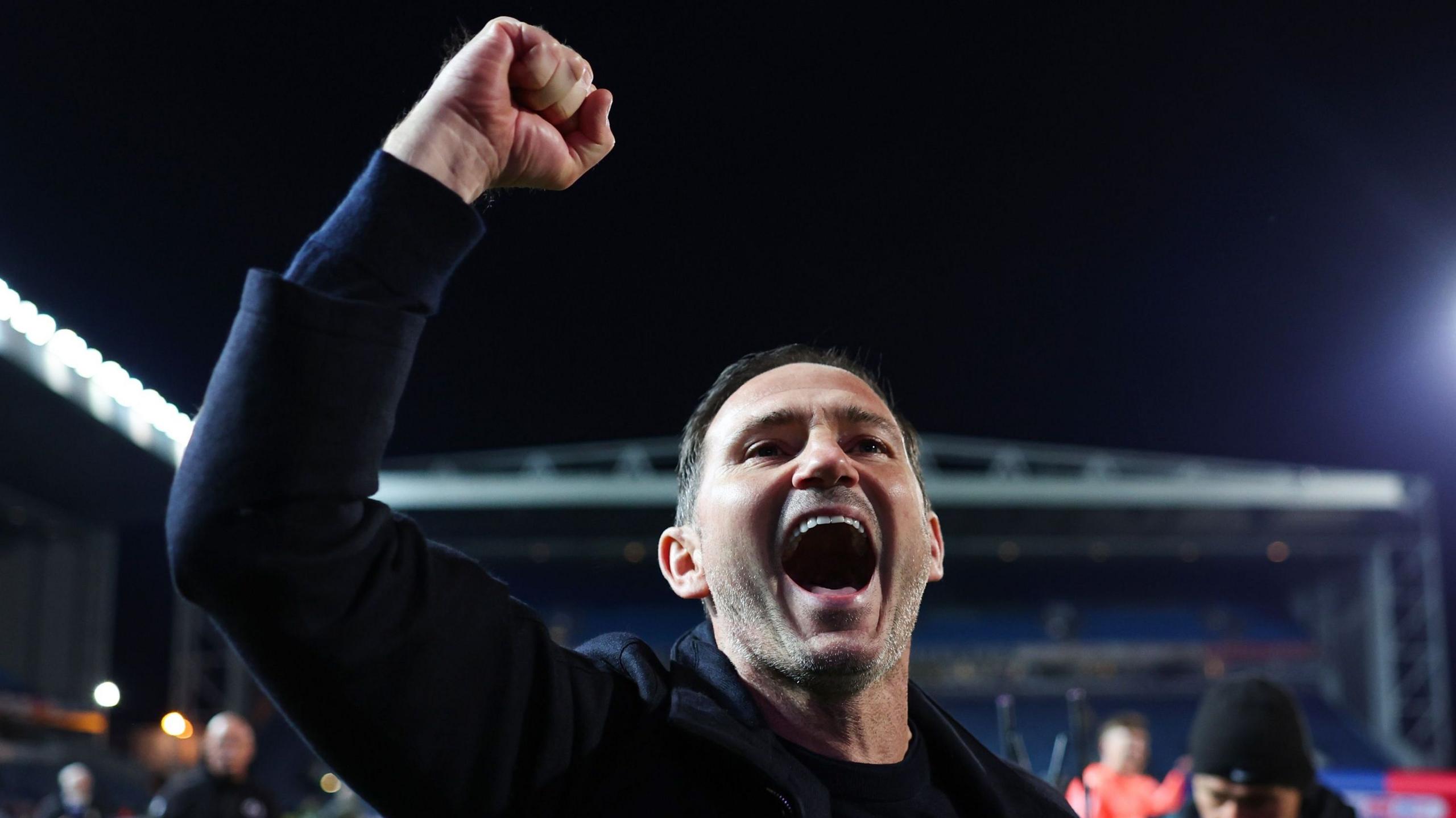 Frank Lampard clenches his fist above his head in celebration after Coventry secured promotion to the Premier League at Blackburn Rovers