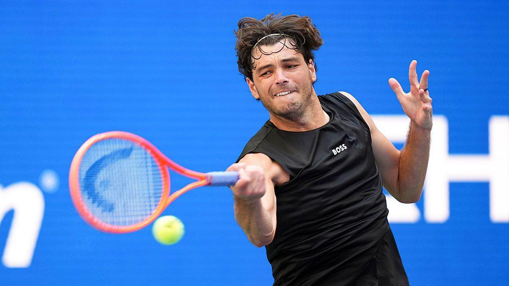 Taylor Fritz strikes the ball during a mixed doubles match at the 2026 US Open in Flushing Meadows, New York