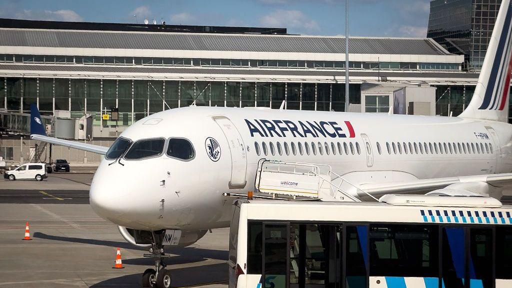 An Air France Airbus A220-300 plane, registration F-HPNM, stands on the apron at Warsaw Chopin Airport in Warsaw, Poland, on May 22, 2026