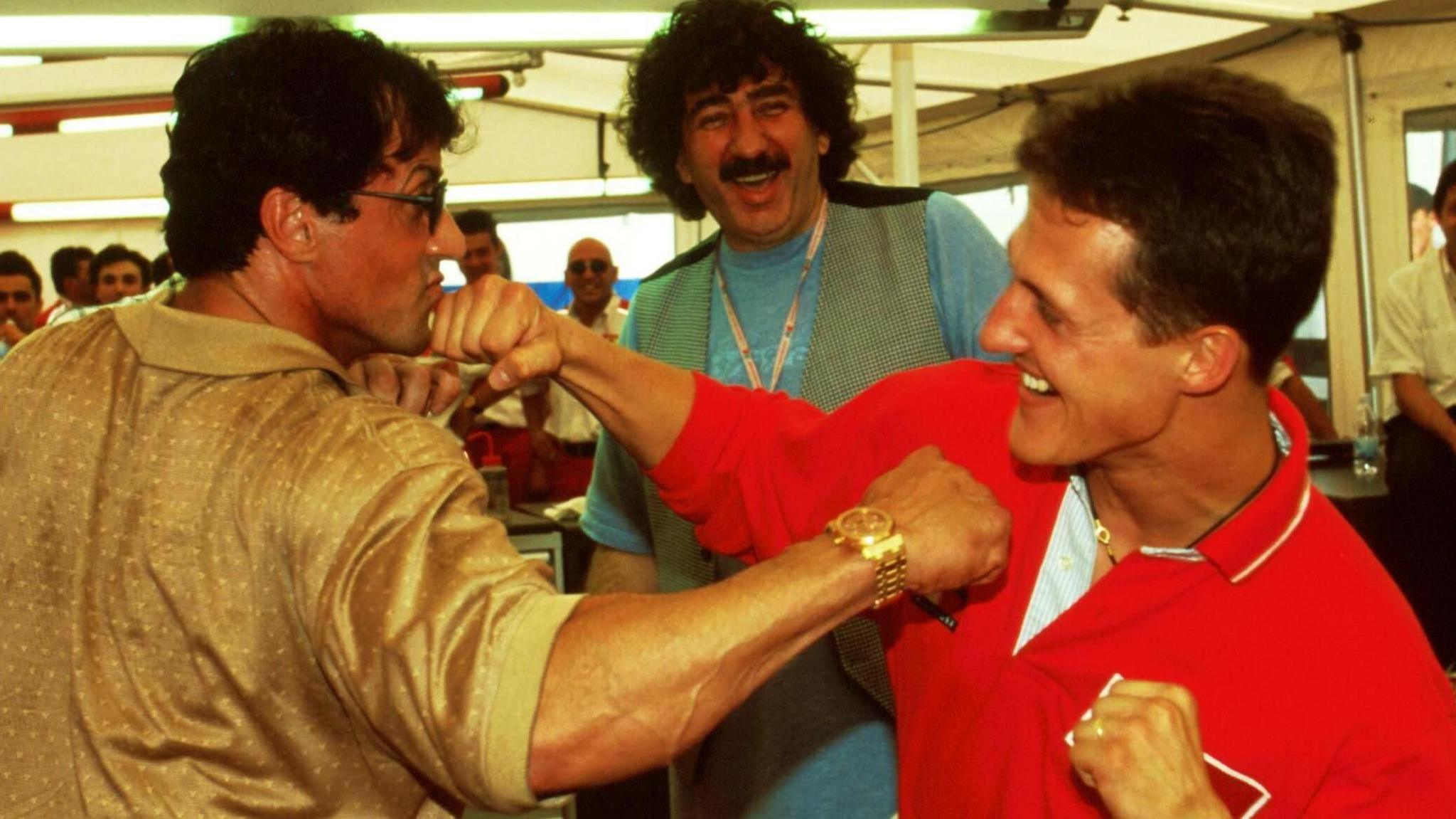 Actor Sylvester Stallone and Ferrari's Michael Schumacher pretend to box in 1998