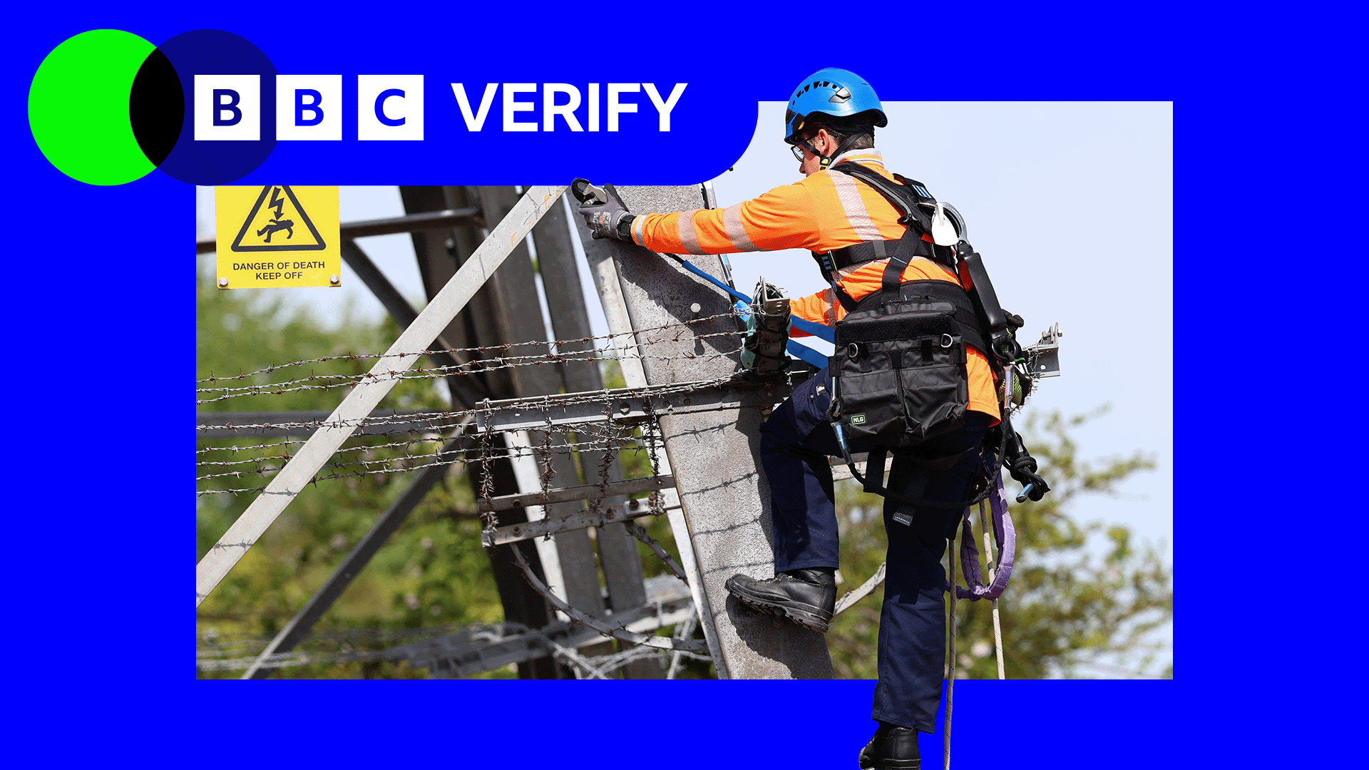 An electrical engineer in full safety gear climbing an electricity pylon