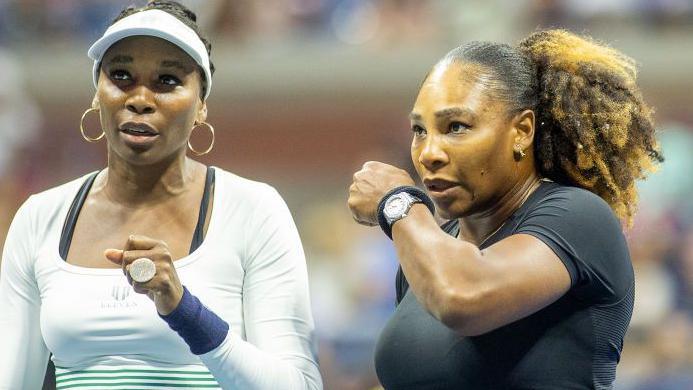 Venus and Serena Williams playing at the 2022 US Open