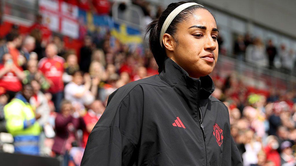 Manchester United defender Gabby George walks out before a game