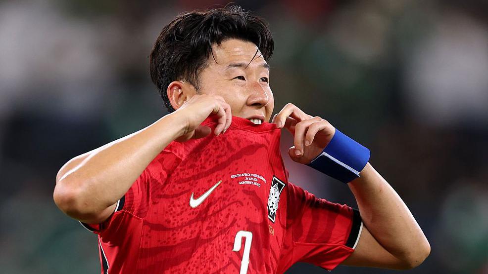 Son Heung-min bites his shirt after South Korea lose to South Africa and are knocked out of the 2026 World Cup