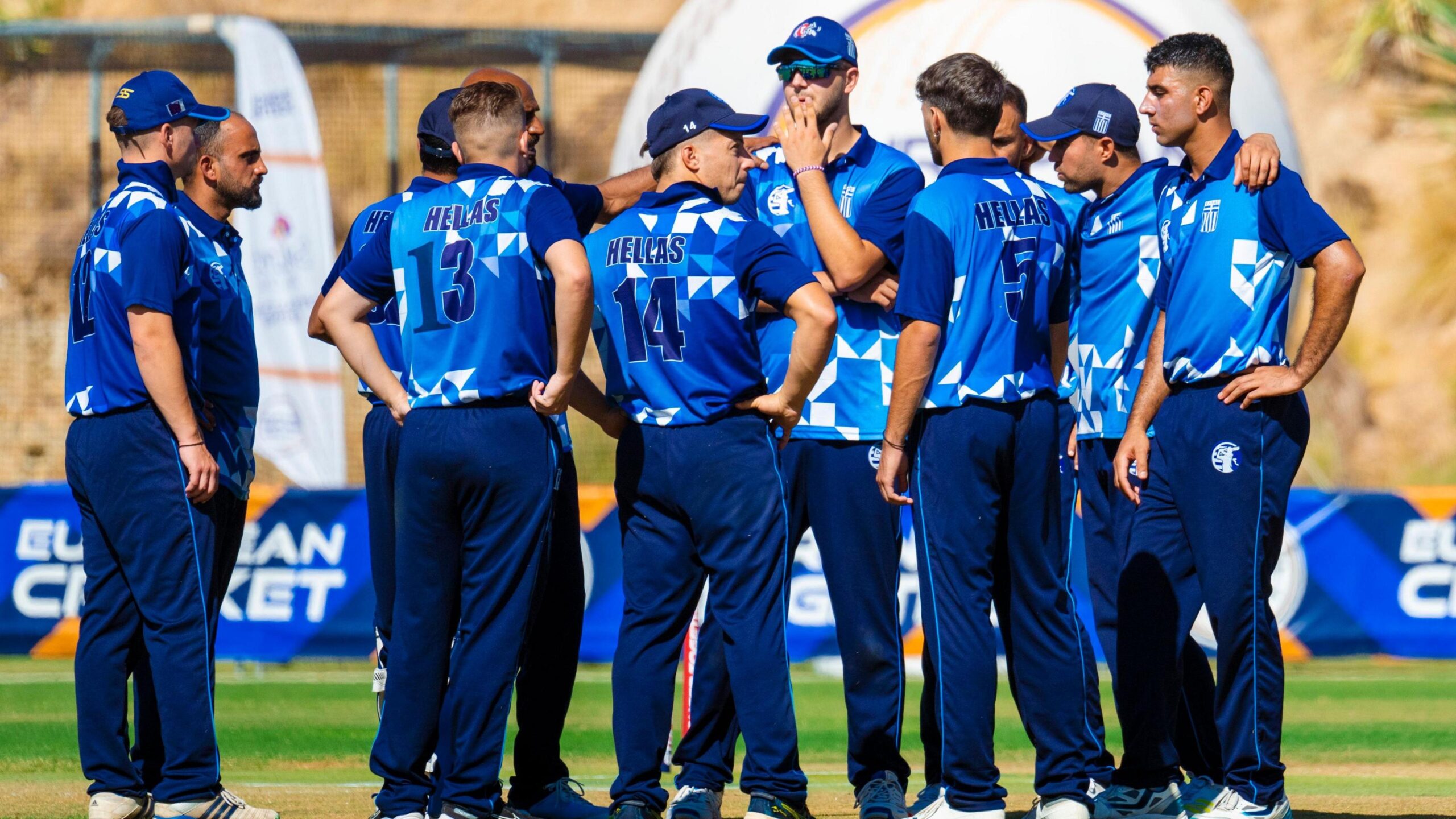 Greece's players comes together to celebrate a wicket at a European Cricket Network event in 2024