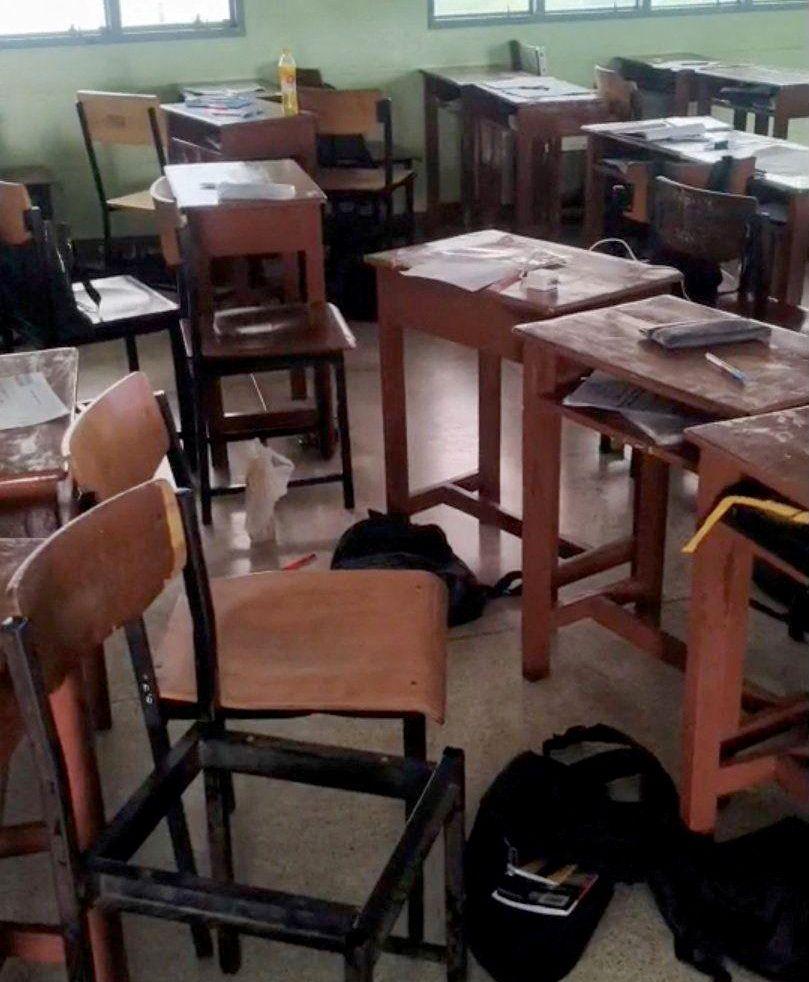Students' belongings and furniture scattered in a classroom, following a shooting incident at Debsirin Nonthaburi School