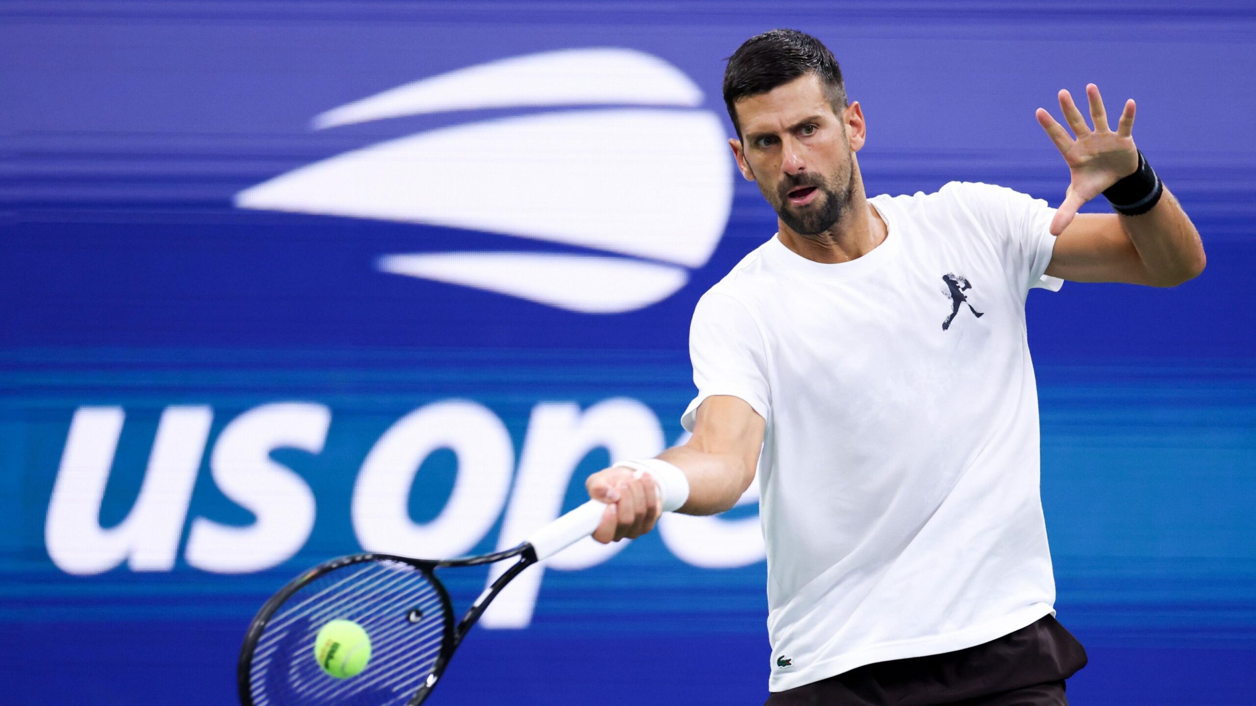 Novak Djokovic hits a return in practice at the 2026 US Open