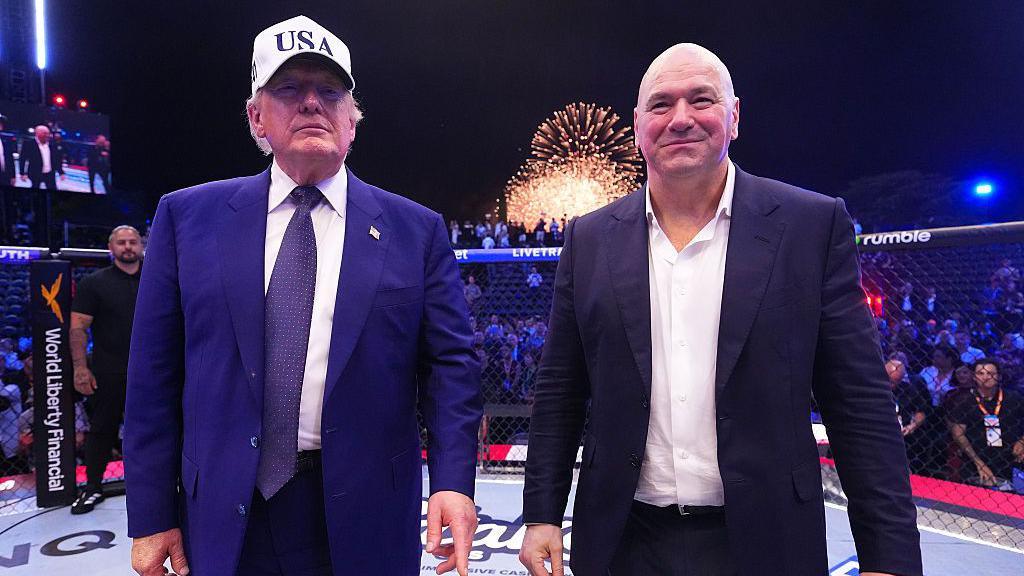 US president Donald Trump stands next to UFC president Dana White