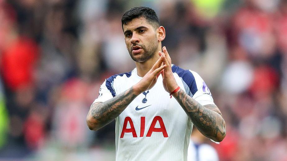 Cristian Romero applauds while playing for Tottenham
