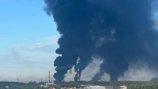 Huge plumes of smoke seen rising in the skies from the site where the Slavneft-Yanos oil is located.