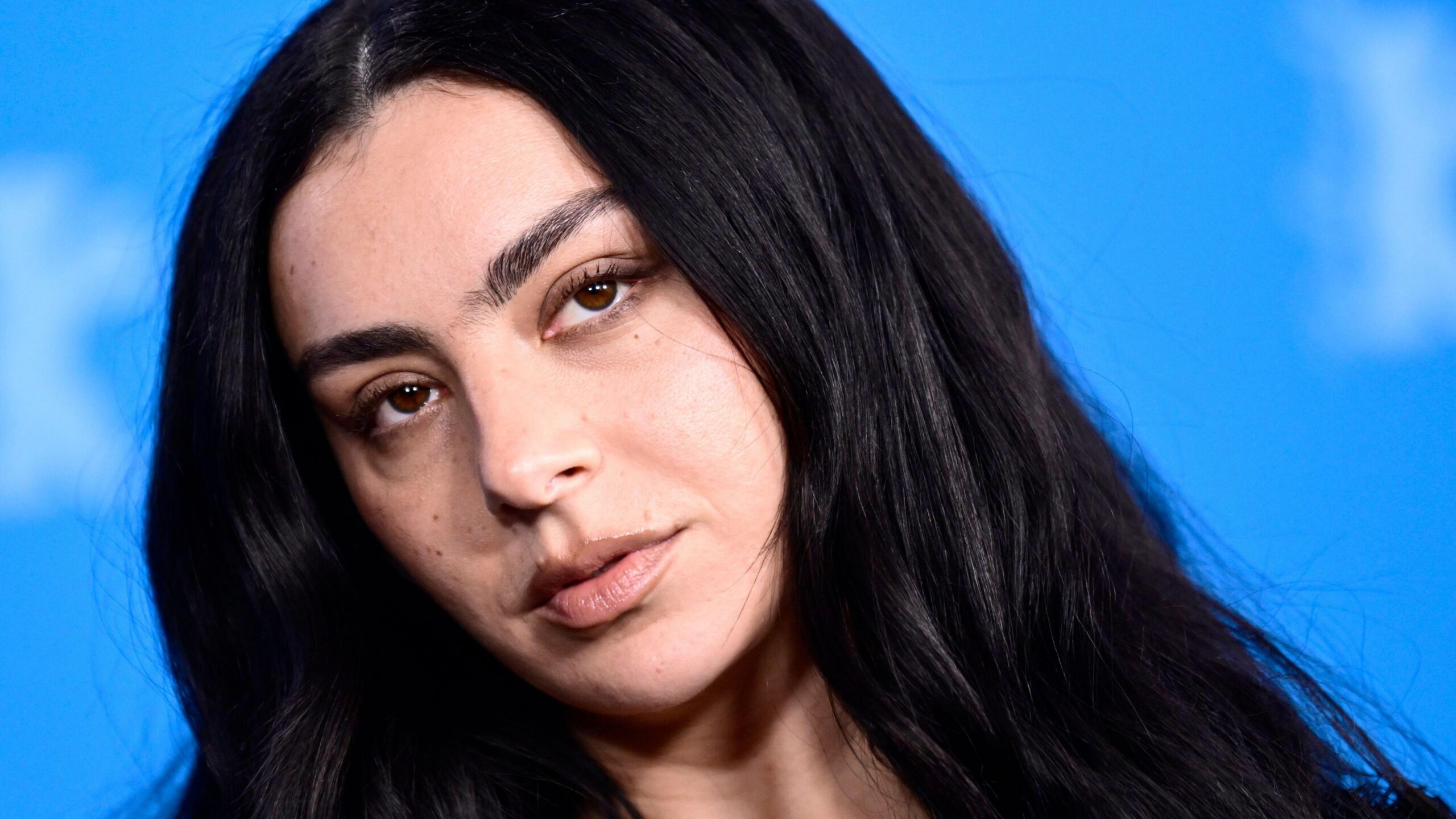 Charli XCX - close up of her face and long, dark hair