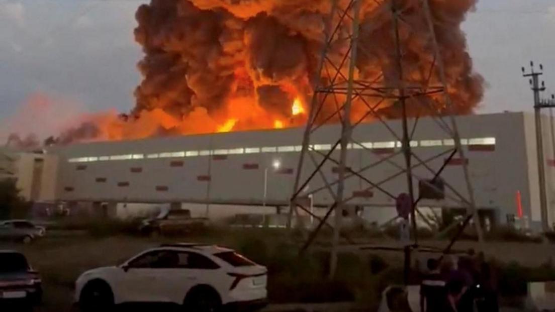 Smoke rises from a Wildberries warehouse on fire after an attack in Nevinnomyssk, Russia, July 22, 2026