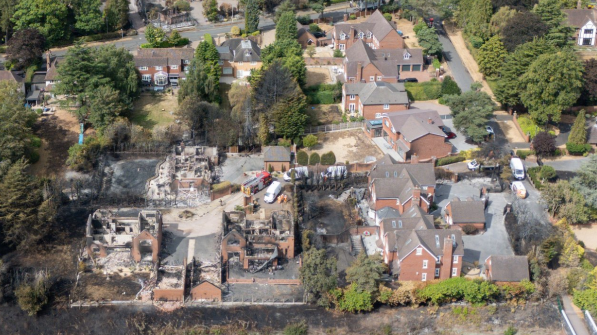 An aerial view of houses damaged by fire with a number of properties largely destroyed