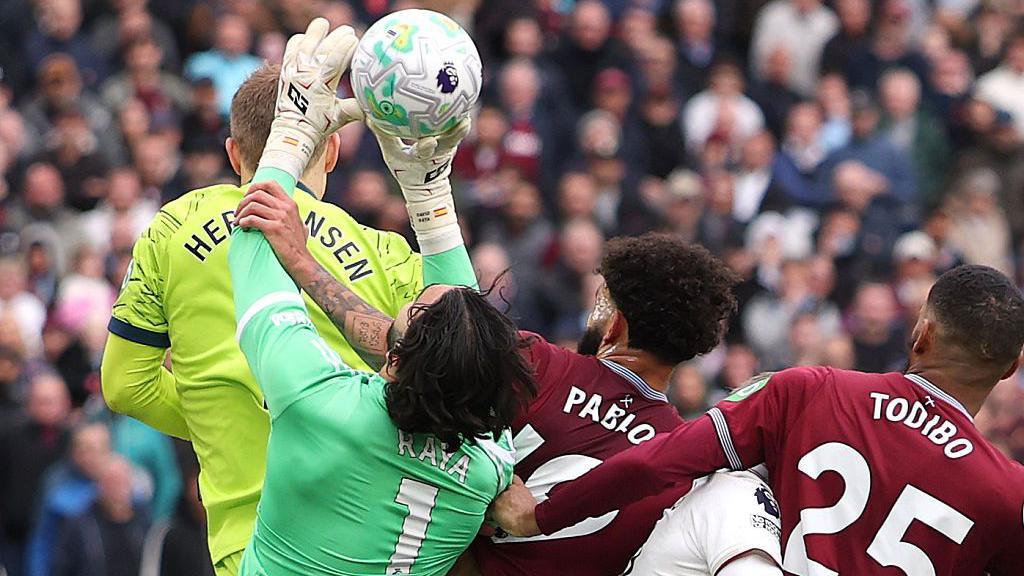 Pablo of West Ham United fouls David Raya of Arsenal before Callum Wilson scores a goal that is later disallowed following a VAR review