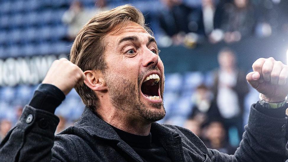 Manager Jakob Poulsen celebrates after Aarhus GF clinch the Danish Superliga title at Brondby in May 2026