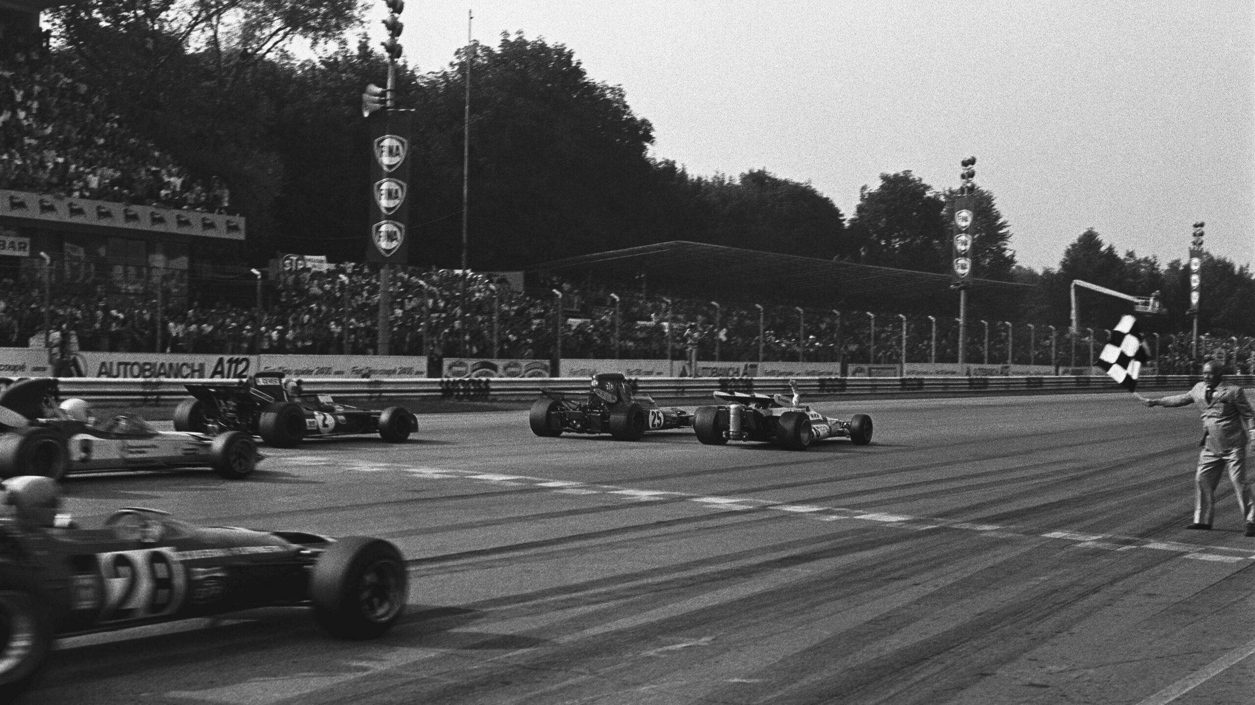 BRM's Peter Gethin crosses the line to win the 1971 Italian Grand Prix just ahead of Lotus' Ronnie Peterson, March's Francois Cevert, Mike Hailwood in a Surtees and BRM's Howden Ganley