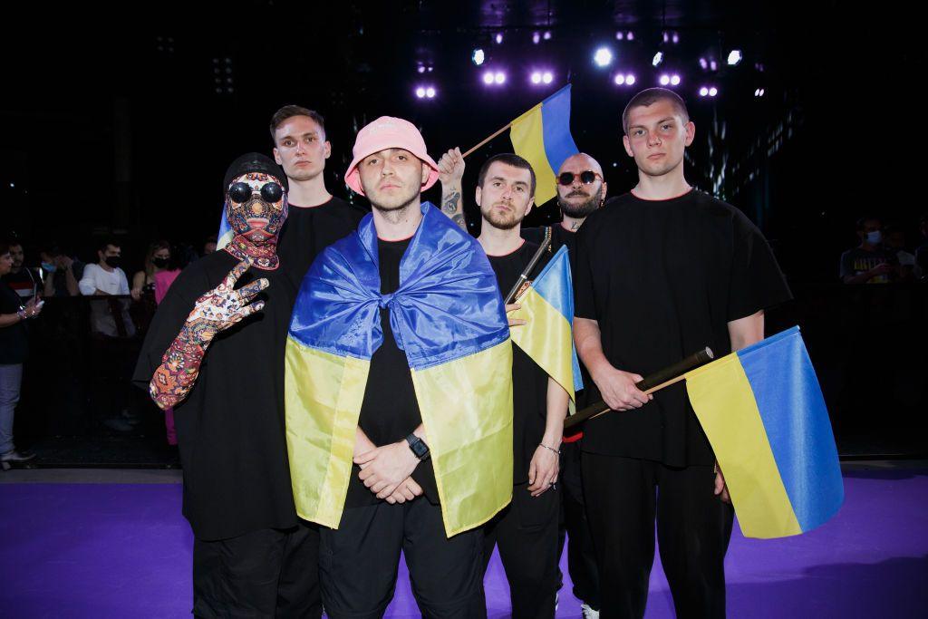 Kalush Orchestra pictured at the Eurovision Song Contest, draped in the Ukrainian flag