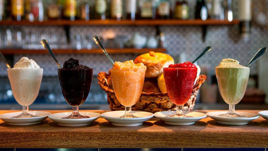 Traditional Granita Siciliana, crushed ice with fruit, Alfredo's bars, Salina island, Aeolian Islands, Sicily, Italy, Europe.