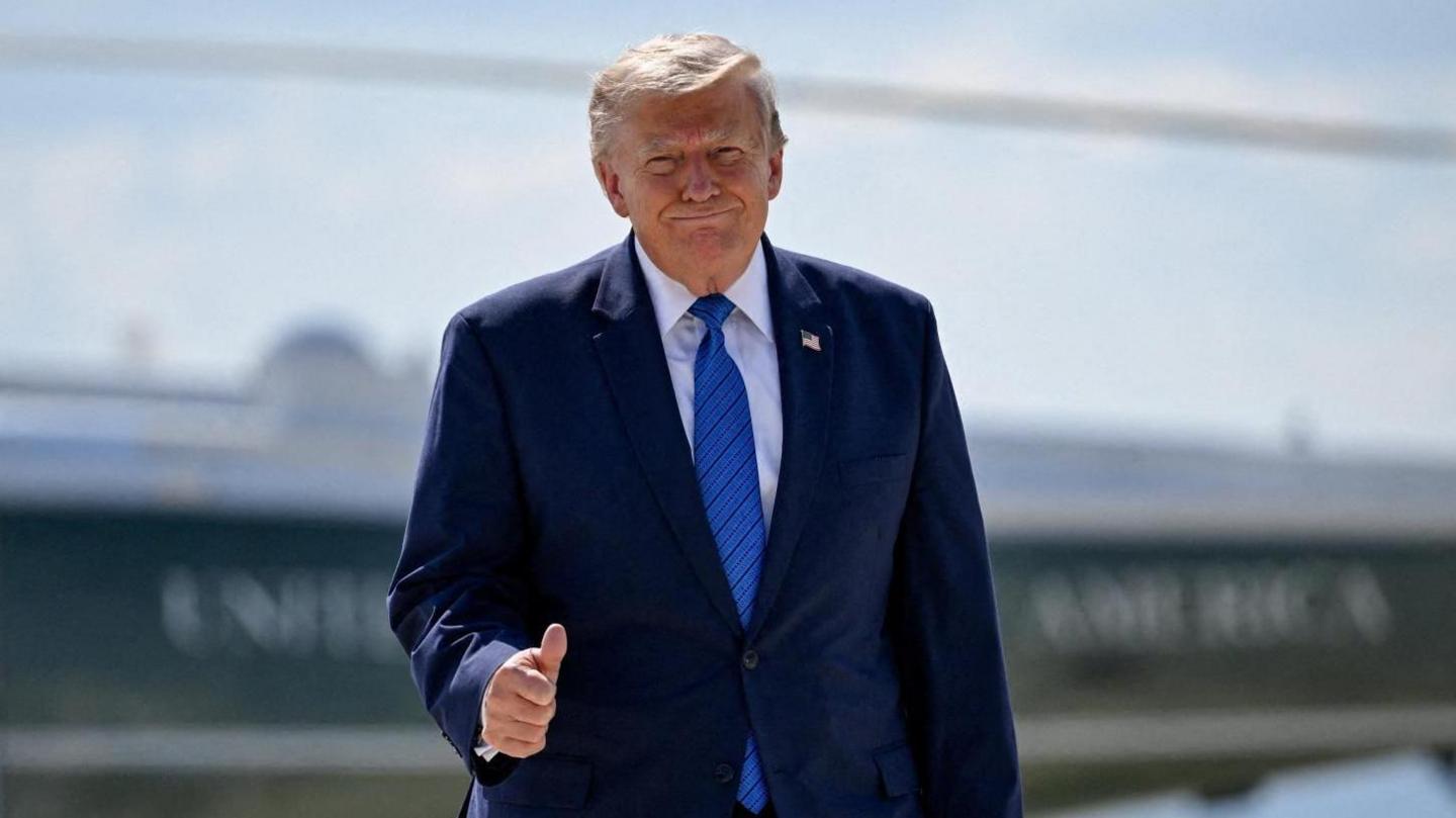 U.S. President Donald Trump gives thumbs-up as he walks from Marine One to board Air Force One.