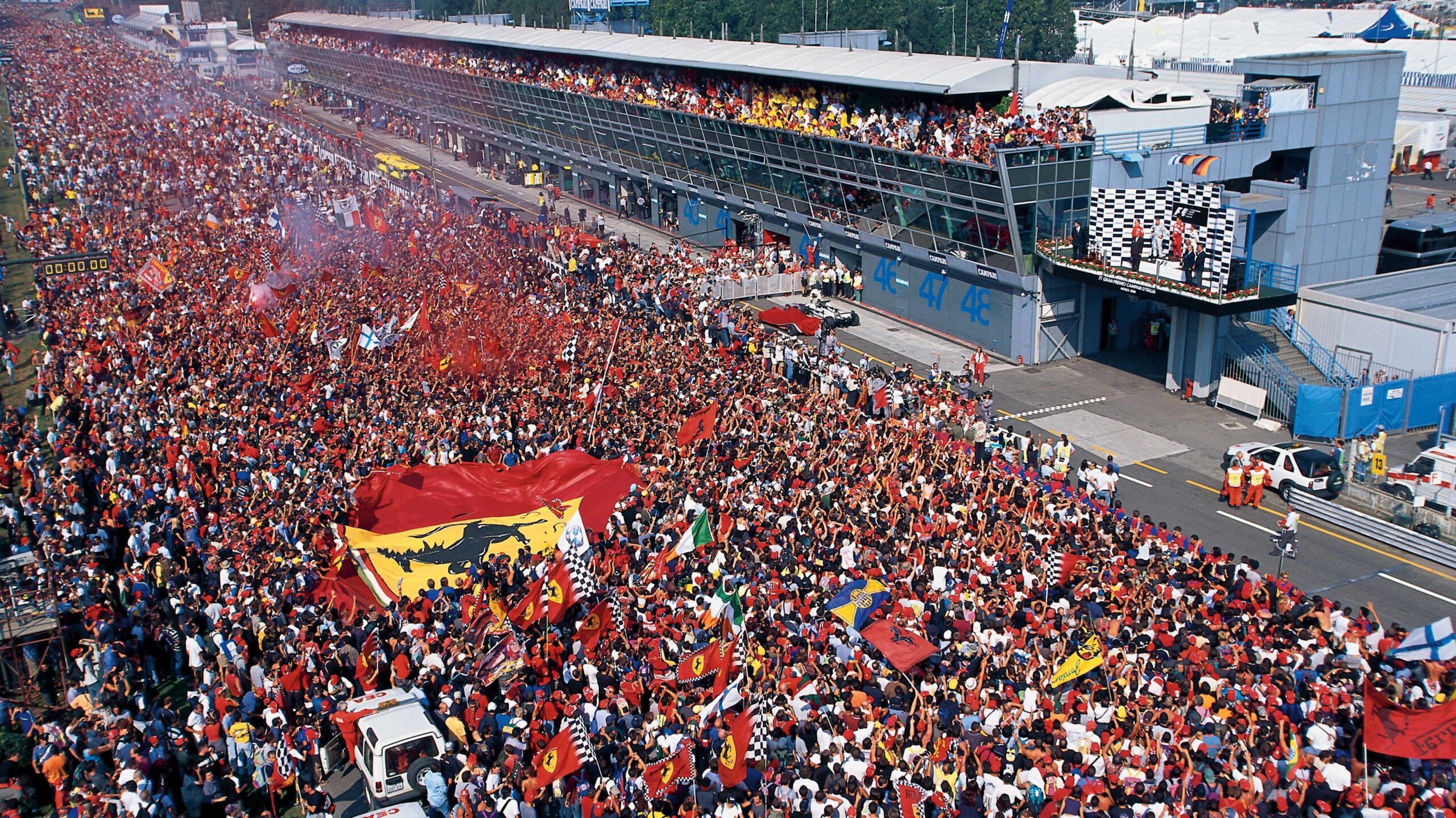 Ferrari fans flood the start-finish straight after the 2000 Italian Grand Prix