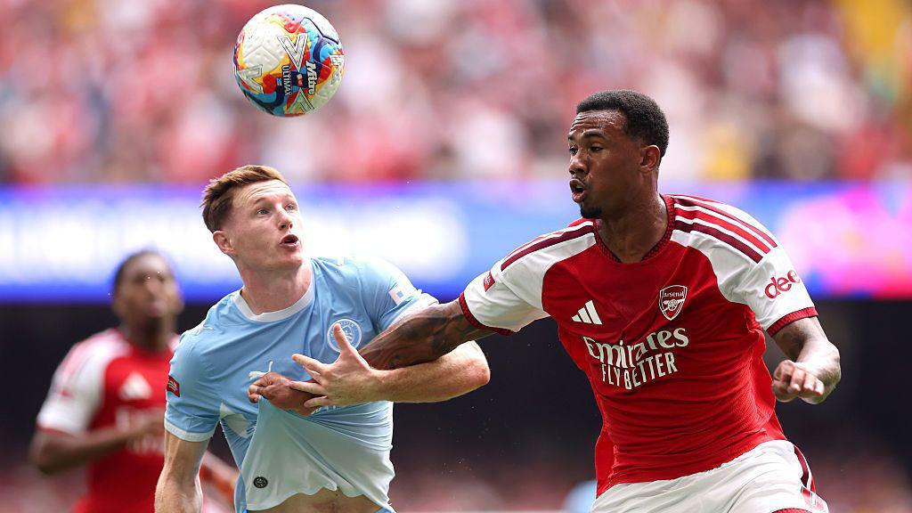 Elliot Anderson grapples with Arsenal defender Gabriel
