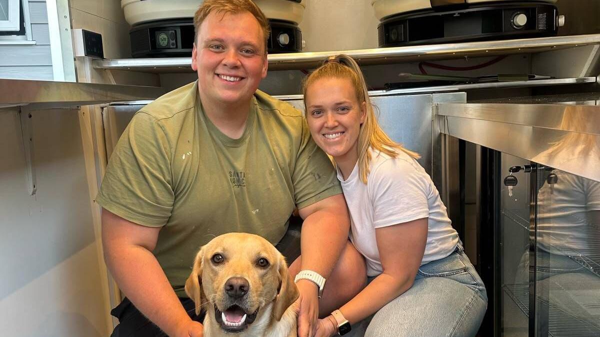 Max and Hannah pose with their dog