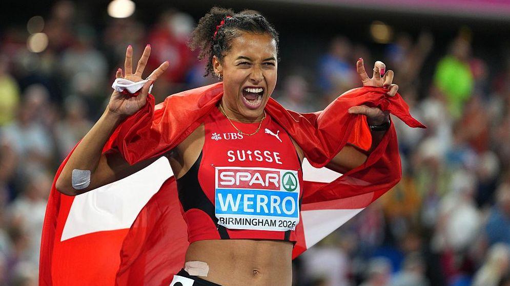 Audrey Werro celebrates by mimicking a lion's claws and roar