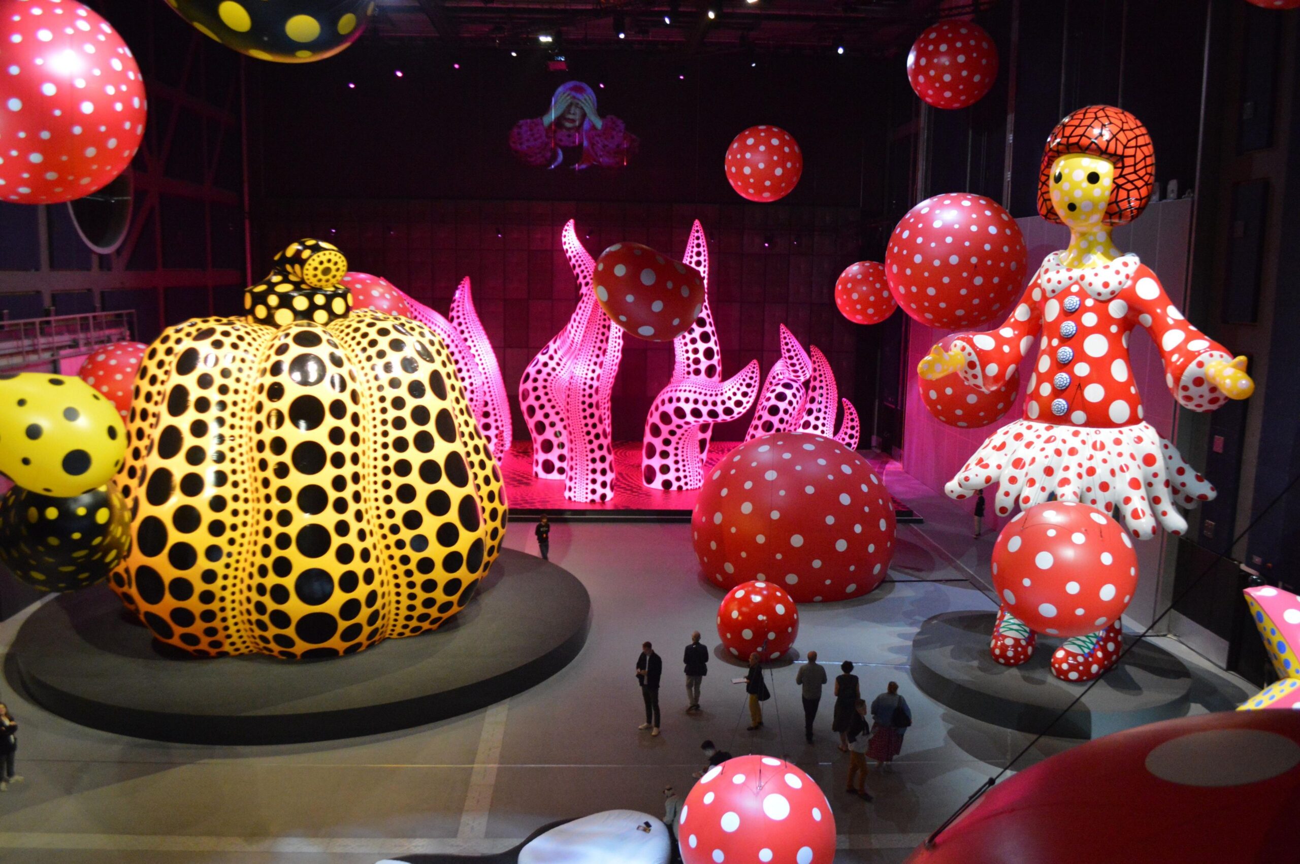 View of several of Kusama's giant colourful sculptures in Manchester
