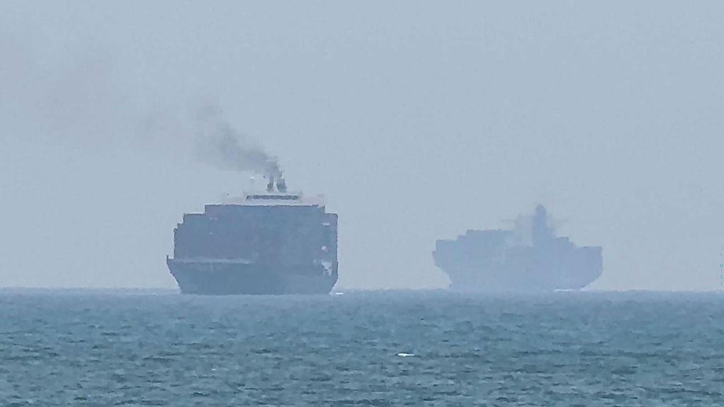 Cargo ships anchoring near the Strait of Hormuz off the eastern coast of the United Arab Emirates at Khor Fakkan on 12 July.
