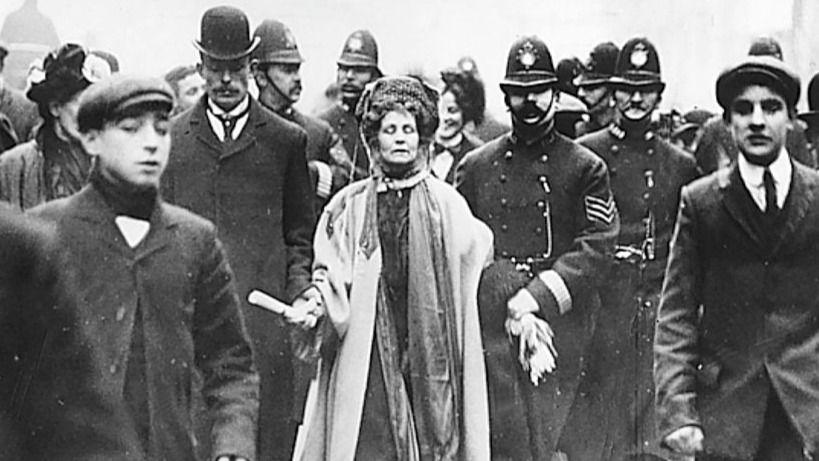 A black andwhite image of Emmeline Pankhurst being arrested