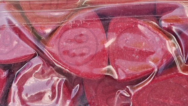 Large bag of red pills.