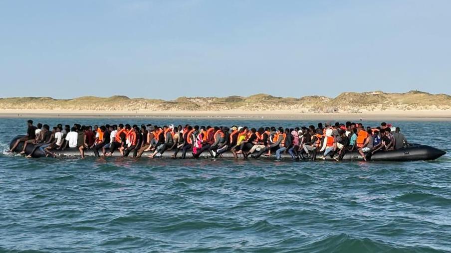 A large inflatable boat carrying 230 people in the Channel