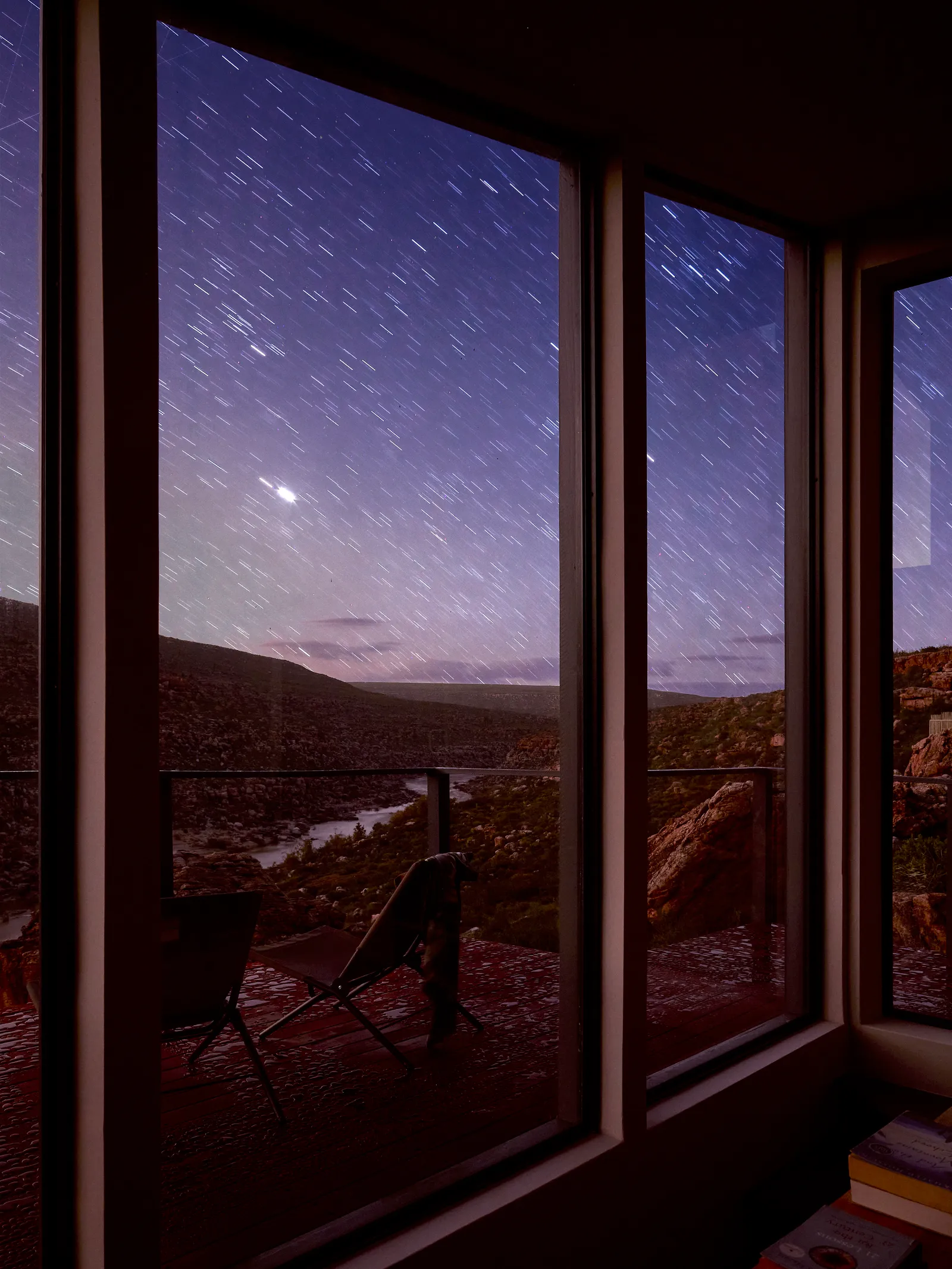 Image may contain Chair Furniture Window Nature Outdoors Sky Picture Window and Scenery