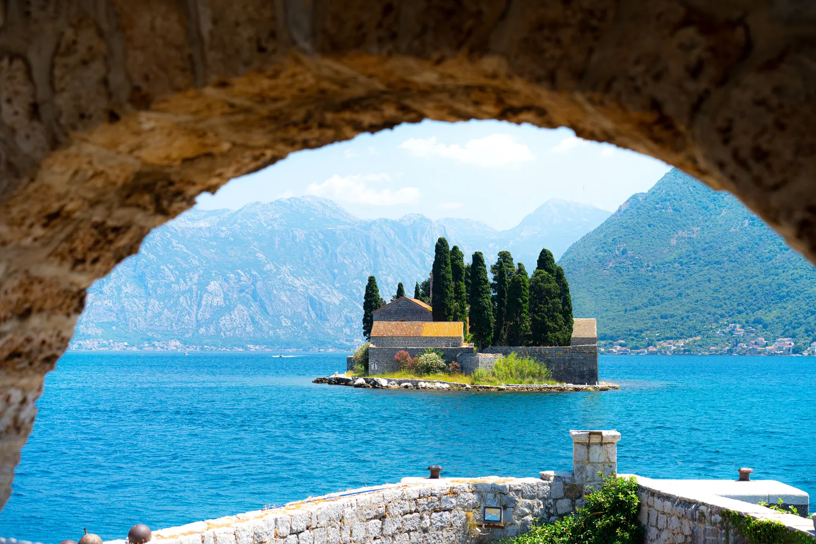 Image may contain Nature Outdoors Scenery Sea Water Architecture Building Castle Fortress Lake Land and Shoreline