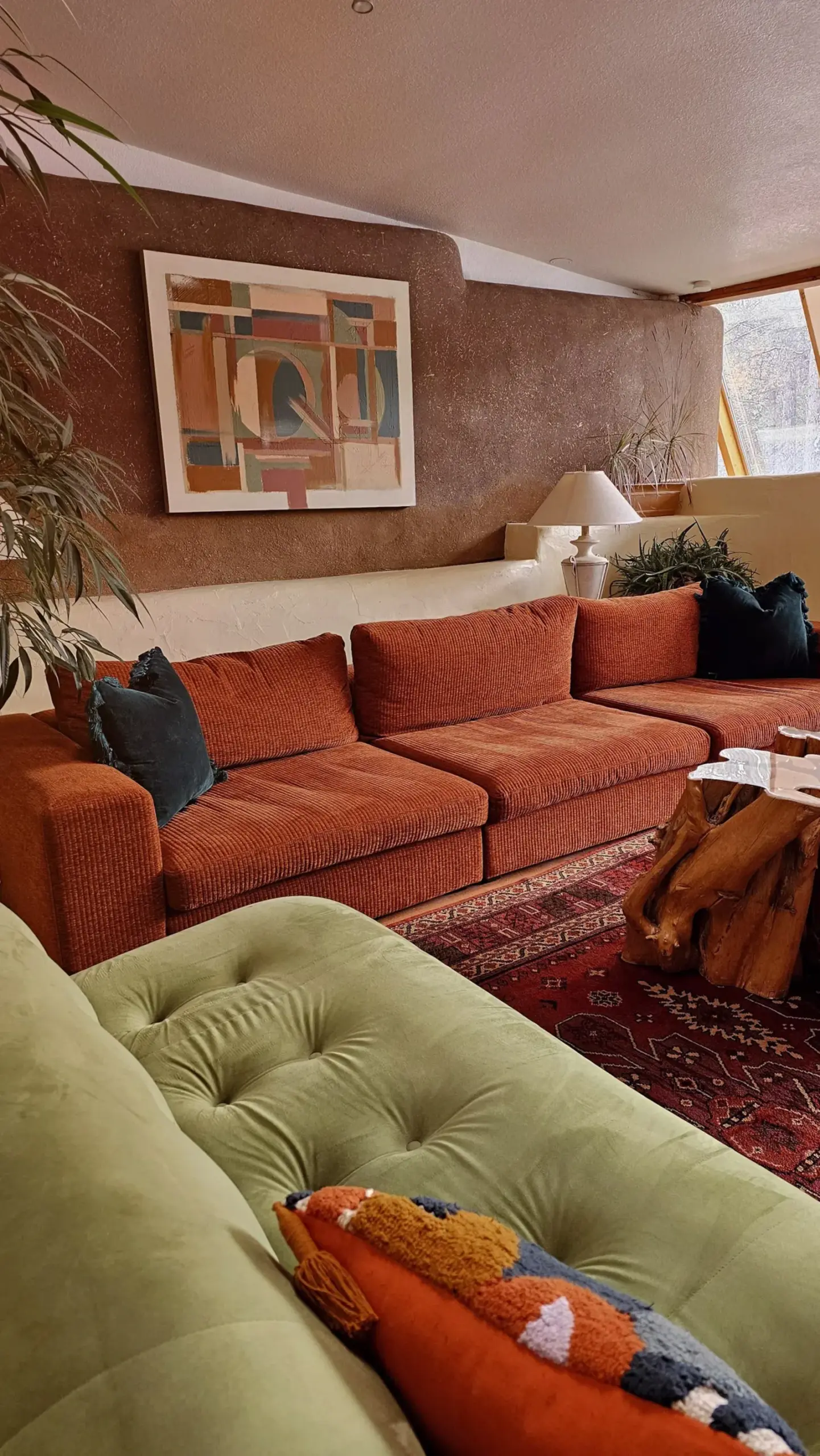 Image may contain Couch Furniture Home Decor Cushion Architecture Building Indoors Living Room and Room
