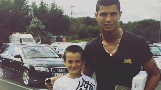 Joe Riley, who joined Manchester United at the age of six, with Cristiano Ronaldo at Manchester United's training ground in 2005