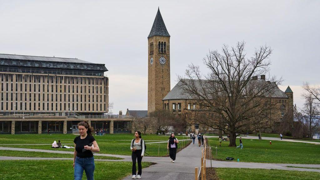 Students walk through the Arts Quad at the Cornell University campus in Ithaca, US, on Tuesday, April 11, 2023