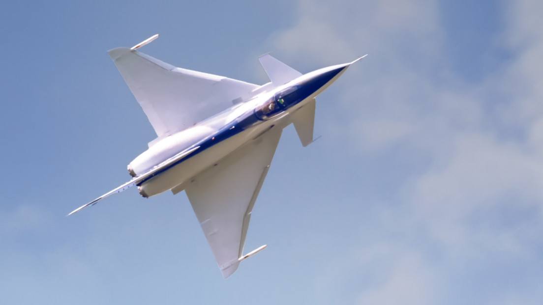 The Experimental Aircraft Programme looks like a fighter jet. The body is white with a blue stripe in the middle.