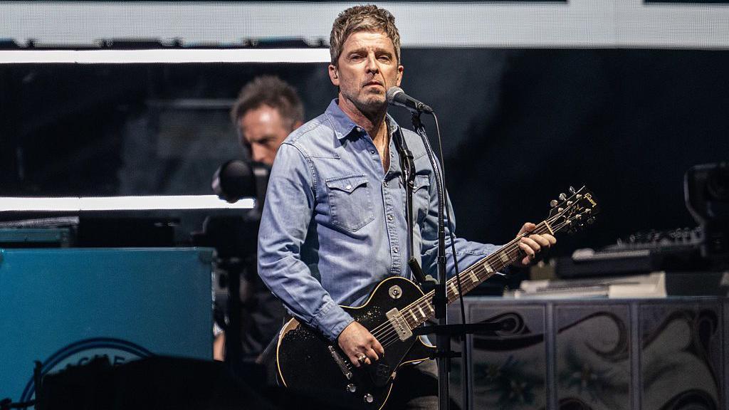 Noel Gallagher on stage in Cardiff on 4 July 20205 as Oasis begin their comeback tour