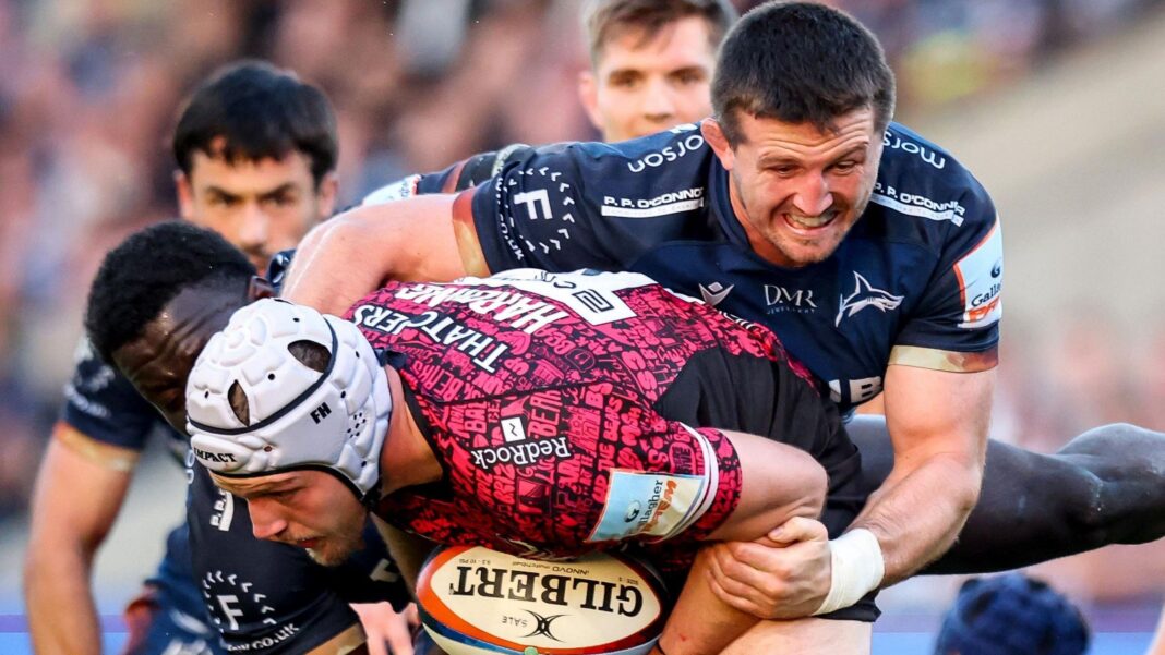 Tom Curry climbs on the back of Bristol's Fitz Harding to tackle him