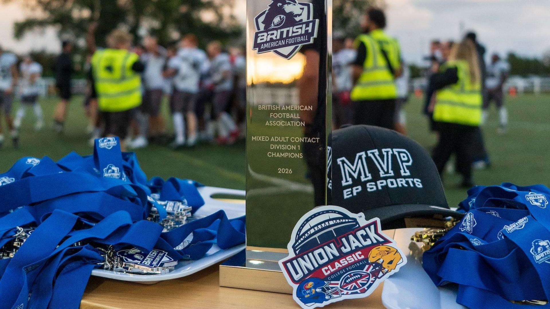 A British American Football Association trophy with medals and a Union Jack Classic badge