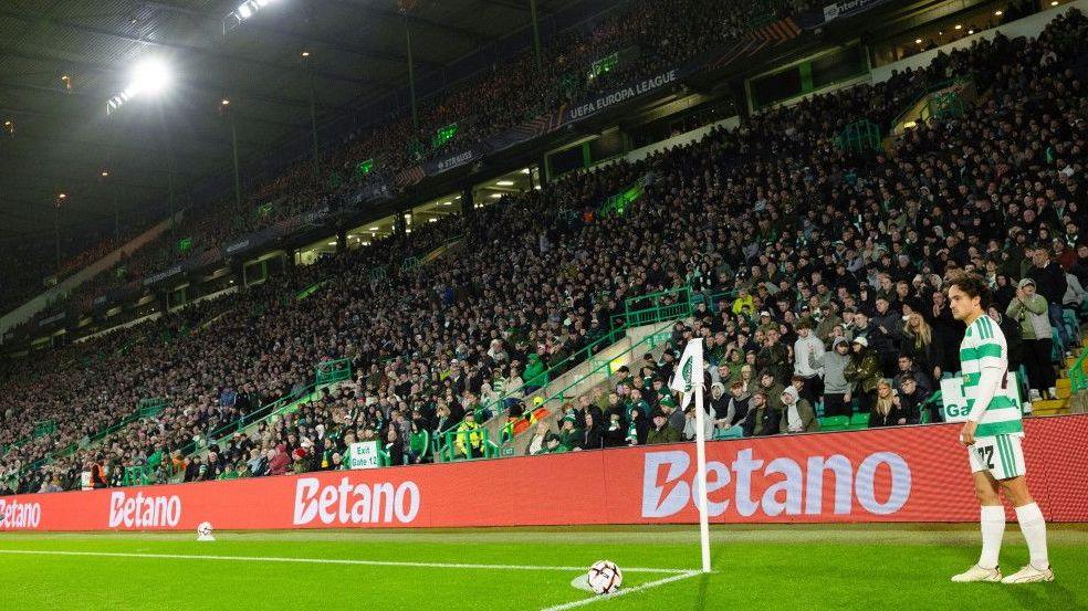 Celtic's Mika Baur prepares to take a corner kick during a Europa League match against Ferencvaros