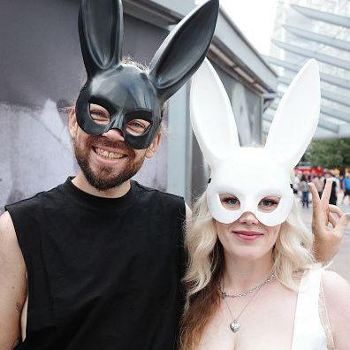 Ariana Grande fans in bunny ear costumes