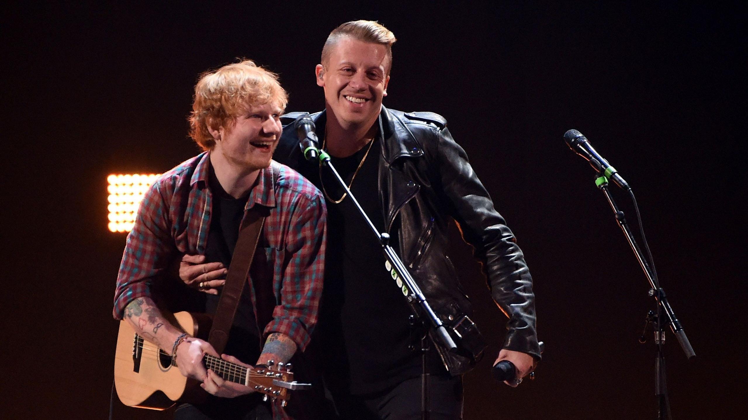 Singer/songwriter Ed Sheeran (L) and rapper Macklemore perform during the 2014 iHeartRadio Music Festival at the MGM Grand Garden Arena on September 20, 2014 in Las Vegas, Nevada.