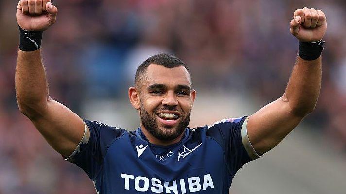 Joe Marchant raises his arms in celebration