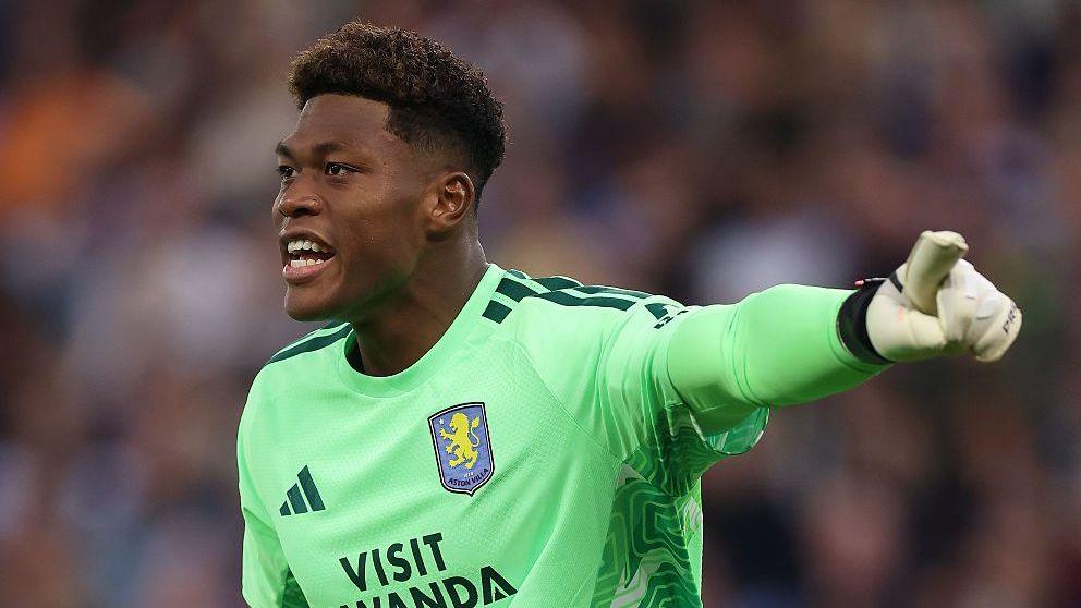 Japan goalkeeper Zion Suzuki gives instructions on his Aston Villa debut against Arsenal.