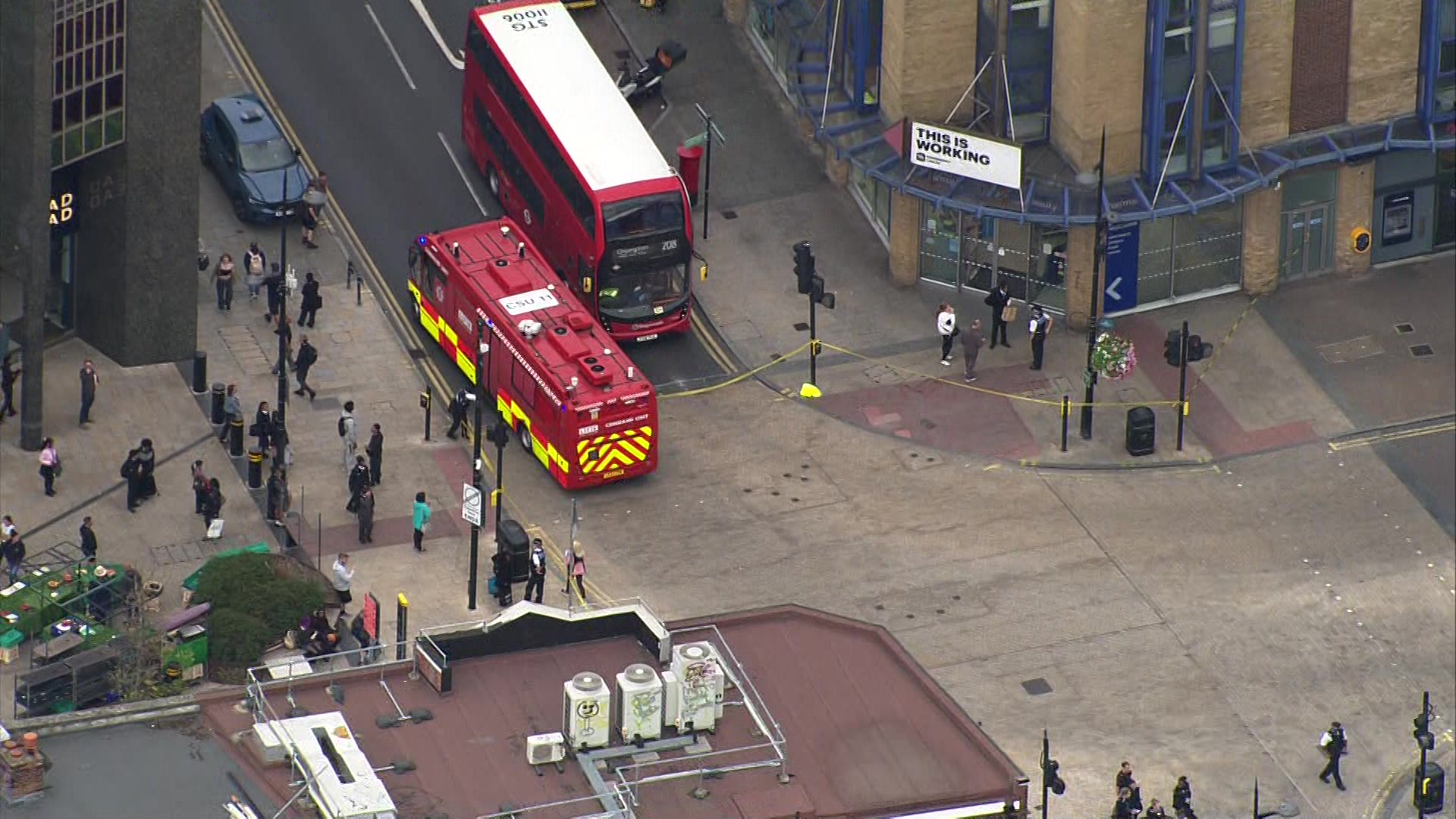 Shot from a helicopter of scene on Bromley High Street with London Fire Brigade at the scene and police cordon in place